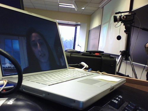 A remote teaching session delivered over video conference to a class of students.